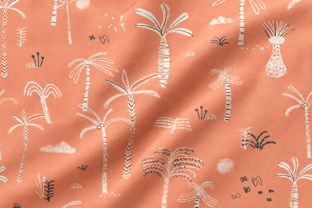 Peach palm print on softly draped fabric